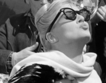 Photo of Anita Ekberg wearing black framed Italian sunglasses while starring in the 1960 film La Dolce Vita