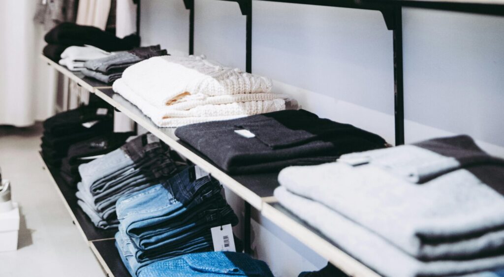 capsule closet example neutral clothing folded organised